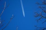 A Long Trail Of Jet Plane On Blue Sky Stock Photo