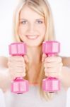 Two Weights In Woman's Hands Stock Photo