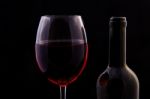 Red Vine In Glass And Open Bottle Stock Photo