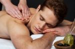 Young Man Getting Spa Massage Stock Photo