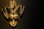 Masks And Feathers Of Venice Carnival On Black Background Stock Photo