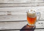 Glass Mug With Beer Standing On The Table Outdoor Stock Photo