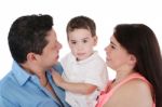 Happy Family: Mother, Father And Son.  Focus In The Boy Stock Photo