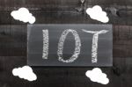 Blackboard Written With The Letters Iot, The Internet Of Things Stock Photo