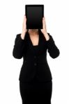 Woman Hiding Her Face With Tablet Pc Stock Photo
