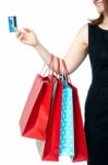 Woman Holding Colorful Shopping Bags And Cash Card Stock Photo