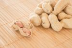 Salted Peanuts On Kitchen Bamboo Mat Stock Photo