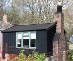 Small Black Living Shed At St Fagans National History Museum Stock Photo