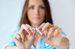 Young Woman Refuses To Smoke And Breaks Cigarette Stock Photo