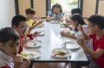 Children Eating Together Stock Photo