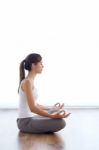 Beautiful Young Woman Doing Yoga Exercises At Home Stock Photo