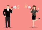 Businessman And Woman Are Shouting On Each Other With Megaphones Stock Photo