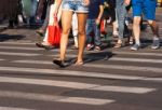Feet Of The Pedestrians On City Street Stock Photo