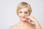 Woman Using Eye Lash Curler Stock Photo