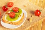 Toast With Kiwi, Cheese And Cherry Tomato Stock Photo