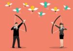 Businessman With A Bow And Arrow Hitting The Money Fly Stock Photo
