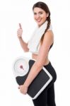 Happy Fitness Woman With A Weighing Scale Stock Photo