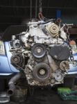 Old Diesel Engine Of Light Truck Maintenance In Garage Service Stock Photo
