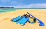 Snorkling Gear On The Beach With Water Bungalows And The Beach In Maldives Stock Photo