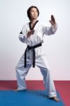 Taekwondo Man Practicing In Gym Stock Photo