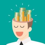 Pile Of Money In Businessman Head Stock Photo