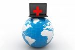Laptop With A First Aid Kit And Globe Stock Photo