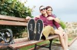 Young Beautiful Couple With Message "just Married" In His Shoes Stock Photo