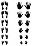 Silhouetted Palm And Foot Print Stock Photo
