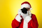 Say Cheese! Santa Capturing A Perfect Moment Stock Photo