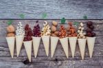 Concept For Homemade Various Nuts Ice Cream. Mixed Nuts In Waffl Stock Photo