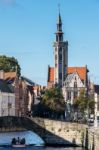 Tourists Enjoying A Boat Trip Around Bruges West Flanders In Bel Stock Photo