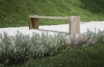 Wooden Bench In Rock Garden Stock Photo
