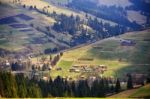 Sunny Spring In Mountain Village. Fields And Hills Stock Photo