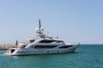 View Of A Luxury Yacht Leaving The Harbour At Porto Banus Stock Photo