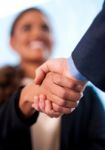 A Handshake Between Business People Stock Photo