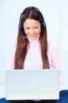 Woman With Headphones And Laptop Stock Photo