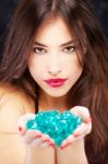 Woman With Blue Rocks Stock Photo