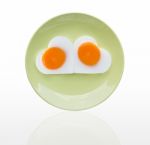 Fried Egg  Heart On Green Dish Stock Photo