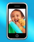 Girl With Toys On Mobile Phone Stock Photo