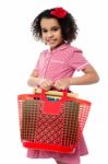 Pretty Child Carrying Math Equipment's In Basket Stock Photo