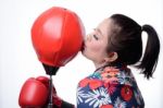 Asian Boxing Woman Kiss Punching Bag Stock Photo
