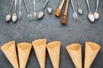 Flat Lay Ice Cream Cones Collection , Spoons ,fork And Honey Dip Stock Photo