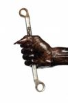 Man's Hand And Wrench In Engine Oil Stock Photo