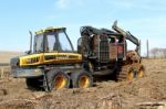 Timber Forwarder On Clear Fell Land Stock Photo