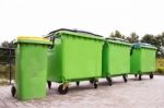 Greeen Garbage Containers In A Row Stock Photo