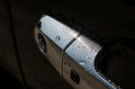 Water Drops On Car Door Handle Stock Photo