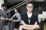 Portrait Of A Business Woman With Her Team In The Background Stock Photo