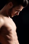 Attractive Muscular Man On Black Background Stock Photo