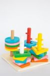 Colorful Puzzle Wooden Toy On White Table Stock Photo