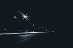 Highway In The City At Night With Streetlights And Long Exposure Stock Photo